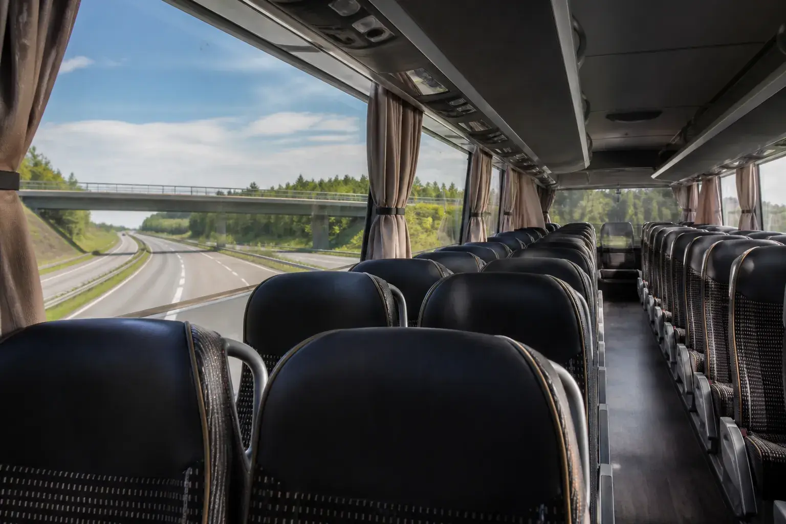 coach interior seats passengers European motorway journey